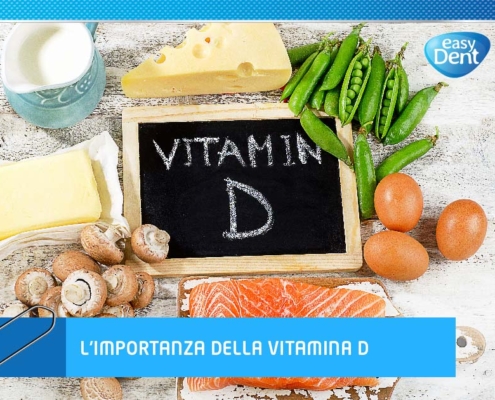 Foto di cibo contenente vitamina D con scritta l'importanza della vitamina D